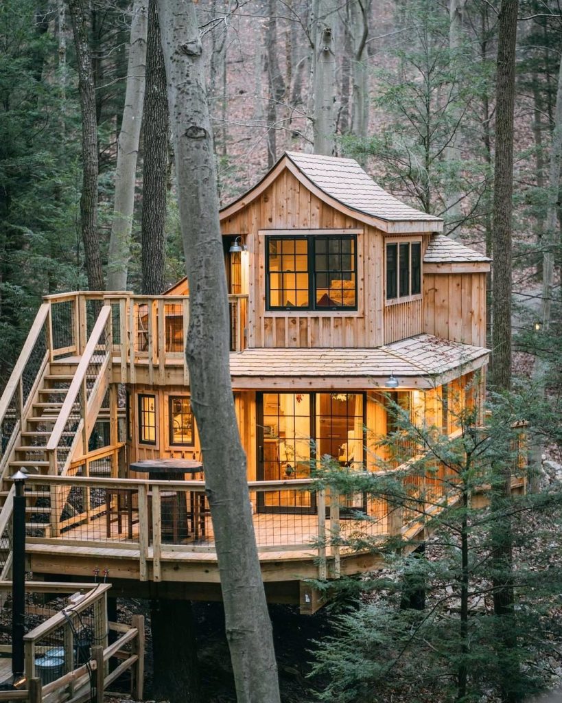 Couple enjoying tree house stay with mountain view